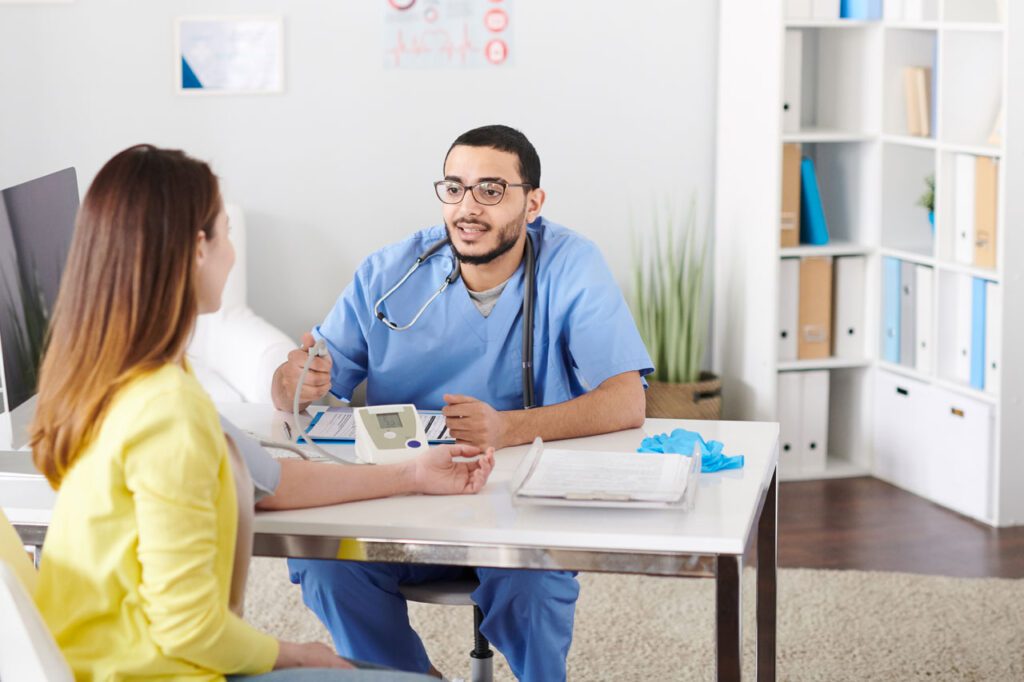 Doctor consulting with patient